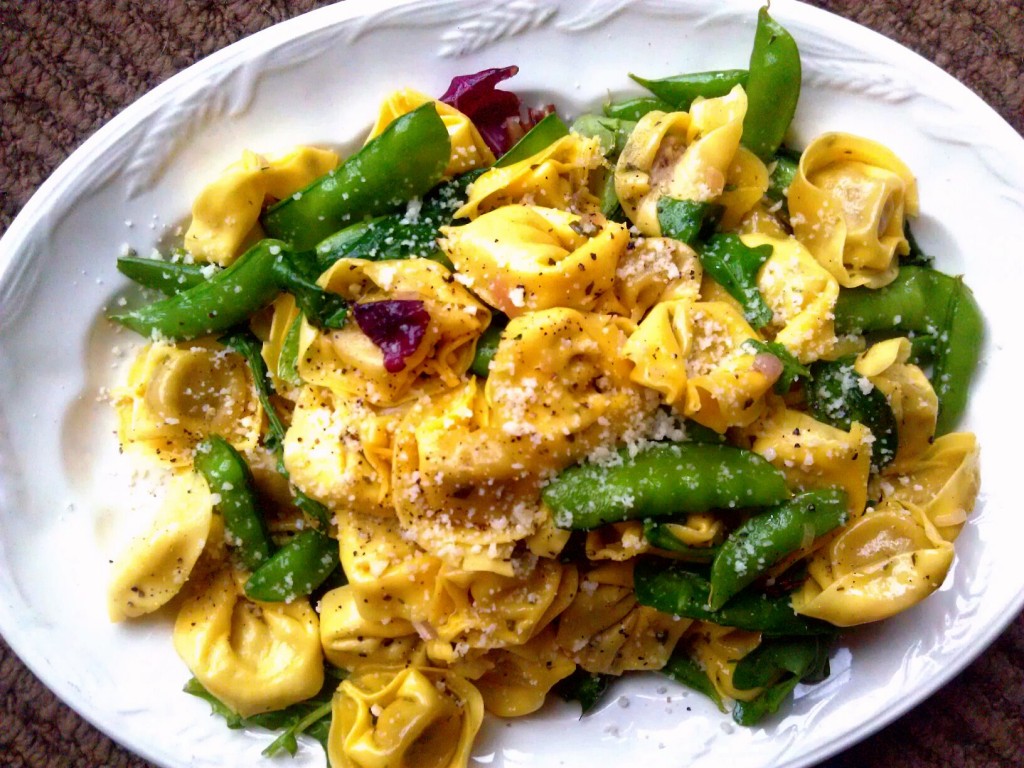 porcini mushroom tortellini in herb butter with sugar snap peas, baby spinach greens + parm.