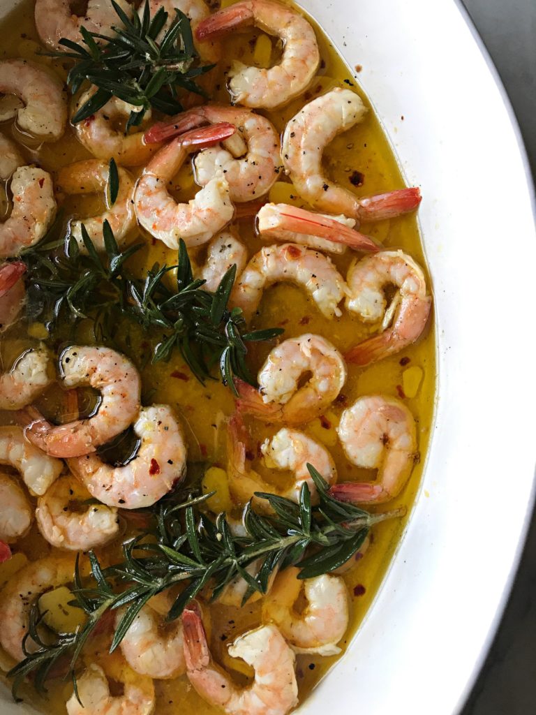 Olive oil and rosemary-poached shrimp with garlic, anchovies, and red pepper flakes